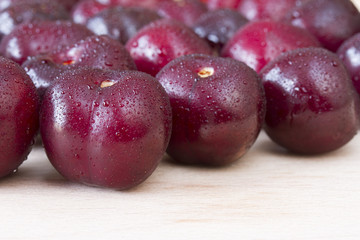 Picota cherries on wooden chopping board