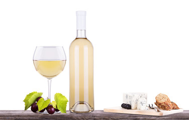 glass of white wine and a bottle with grapes