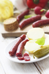 Sausages with potato and gherkin
