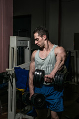 bodybuilder doing heavy weight exercise for shoulder 