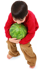 Fototapeta premium Happy Caucasian Boy Child Carrying Watermelon