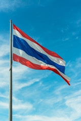 waving Thai flag with blue sky background