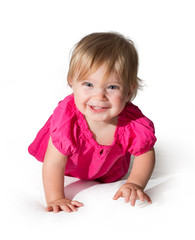 Beautiful little girl smiling with pink dress