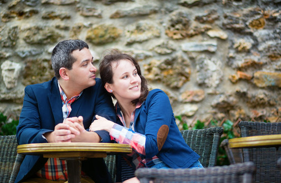 Couple in an outdoor Parisian cafe