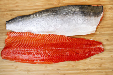 Fresh Red Salmon Fillets on Bambbo Board