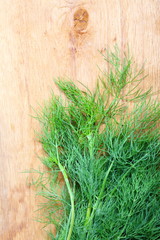 bunch fresh dill herb on wooden table