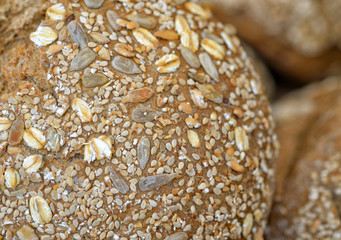 Fresh organic whole grain bread closeup image