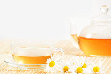 teacup with herbal chamomile tea