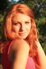 Naklejka premium Young pretty red hair woman outdoor fashion summer portrait 