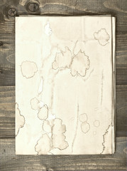 old sheets of paper on aged wood