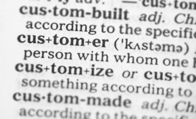 Fototapeta premium Macro image of dictionary definition of customer