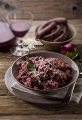 risotto with red wine and sausage, selective focus