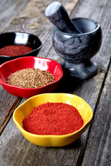 Spices and  mortar with  pestle on a table