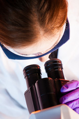 Researcher microscoping.