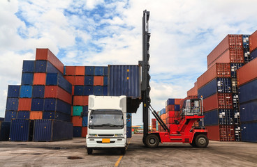 Stack of Freight Containers at the Docks with Truck