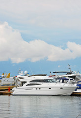 Fototapeta na wymiar White motor yacht over harbor pier, Odessa, Ukraine