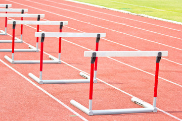 hurdles on the red running track