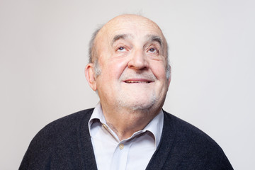 Fototapeta premium old man smiling and looking up