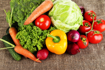 Fresh vegetables on burlap background