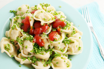 Boiled dumplings with tomato sauce
