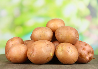 Potato on wooden table