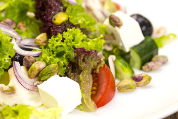 Greek salad on a white background in the restaurant