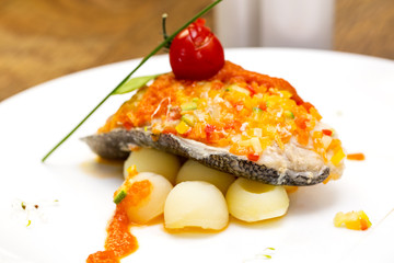 baked fish with potatoes in tomato sauce