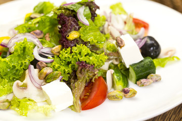 Greek salad on a white background in the restaurant