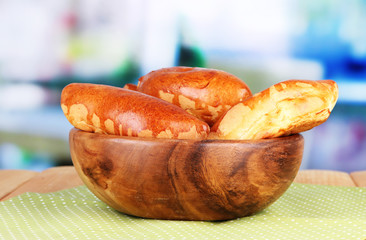Fresh baked pasties, in wooden bowl,