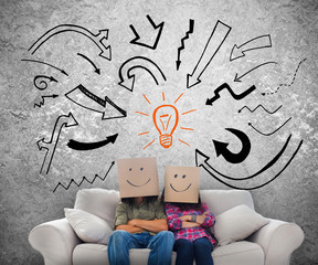 Smiling employees with boxes on their heads