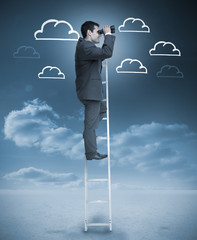 Businessman standing on a ladder over clouds