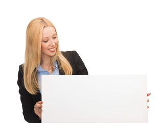 Naklejka premium businesswoman with white blank board