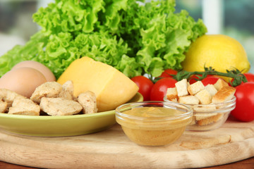 Ingredients for Caesar salad on bright background
