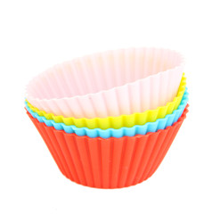 Stack of colorful cupcake cases isolated on white