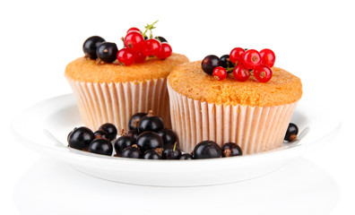 Tasty muffins with berries isolated on white