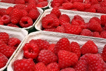 Raspberries in baskets on the table