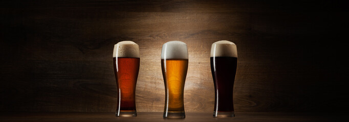 tree glass beer on wood background with copyspace
