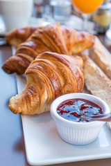 Breakfast with coffee and croissants