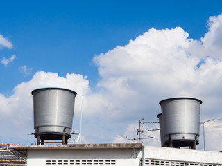 Obraz premium Rooftop water tanks on apartment building