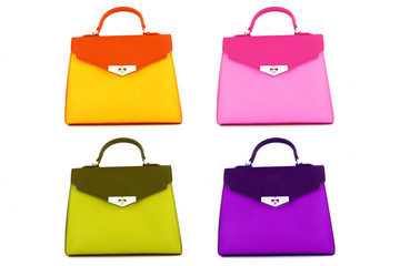 Set of multicolored female bags on a white background