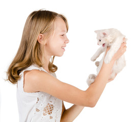 cute girl affectionately hugging kitten. isolated on white