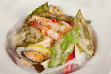 Mixed and spicy seafood salad with crispy vegetable.