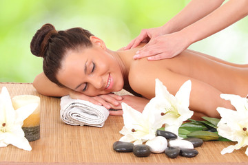 Fototapeta na wymiar Young woman on spa massage