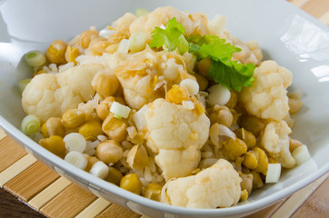 Vegetables curry with cauliflower, chickpeas and spring onions