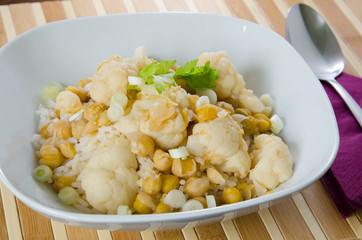 Vegetables curry with cauliflower, chickpeas and spring onions