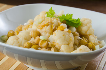 Vegetables curry with cauliflower, chickpeas and spring onions