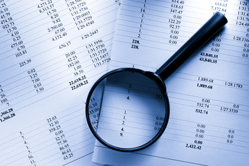 Operating budget and magnifying glass
