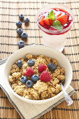 Cereals with blueberries and raspberries, pannacotta on backgrou