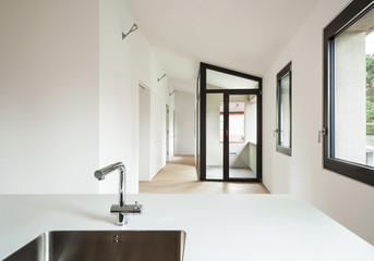 interior new house, modern white kitchen, view room with windows