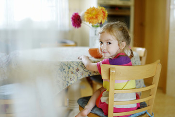 Little girl eating porrige
